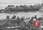 Image of Medics tend to wounded U.S. soldiers on beach Normandy France, 1944, second 47 stock footage video 65675022977