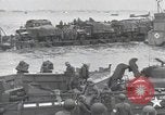 Image of Medics tend to wounded U.S. soldiers on beach Normandy France, 1944, second 48 stock footage video 65675022977