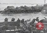 Image of Medics tend to wounded U.S. soldiers on beach Normandy France, 1944, second 49 stock footage video 65675022977