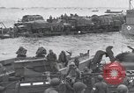 Image of Medics tend to wounded U.S. soldiers on beach Normandy France, 1944, second 50 stock footage video 65675022977