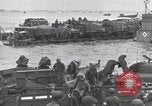 Image of Medics tend to wounded U.S. soldiers on beach Normandy France, 1944, second 51 stock footage video 65675022977