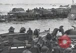 Image of Medics tend to wounded U.S. soldiers on beach Normandy France, 1944, second 52 stock footage video 65675022977
