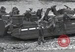 Image of Medics tend to wounded U.S. soldiers on beach Normandy France, 1944, second 55 stock footage video 65675022977