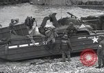 Image of Medics tend to wounded U.S. soldiers on beach Normandy France, 1944, second 59 stock footage video 65675022977