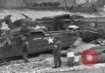 Image of Medics tend to wounded U.S. soldiers on beach Normandy France, 1944, second 61 stock footage video 65675022977
