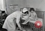 Immagine di Bambino soffre di tubercolosi Detroit Michigan USA, 1936, secondo 15 filmato di repertorio 65675023152