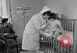 Immagine di Bambino soffre di tubercolosi Detroit Michigan USA, 1936, secondo 20 filmato di repertorio 65675023152