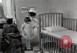 Immagine di Bambino soffre di tubercolosi Detroit Michigan USA, 1936, secondo 55 filmato di repertorio 65675023152