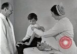 Standbild Arzt vaccinates Boy Detroit Michigan USA, 1936, aus Sekunde 40 historischem Filmmaterial Videoclip 65675023153