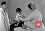 Standbild Arzt vaccinates Boy Detroit Michigan USA, 1936, aus Sekunde 41 historischem Filmmaterial Videoclip 65675023153