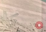 Standbild Gun camera footage strafing Ziele Tarumizu Kyushu in Japan, 1945, aus Sekunde 51 historischem Filmmaterial Videoclip 65675023197