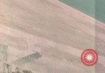 Standbild Gun camera footage strafing Ziele Tarumizu Kyushu in Japan, 1945, aus Sekunde 52 historischem Filmmaterial Videoclip 65675023197