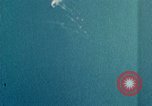 Standbild Gun camera footage strafing Ziele Tarumizu Kyushu in Japan, 1945, aus Sekunde 54 historischem Filmmaterial Videoclip 65675023197