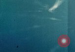 Standbild Gun camera footage strafing Ziele Tarumizu Kyushu in Japan, 1945, aus Sekunde 55 historischem Filmmaterial Videoclip 65675023197