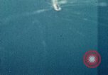 Standbild Gun camera footage strafing Ziele Tarumizu Kyushu in Japan, 1945, aus Sekunde 60 historischem Filmmaterial Videoclip 65675023197