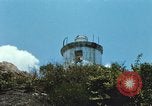 Immagine di Faro francese tower e navi in Cam Ranh Bay Vietnam Cam Ranh Bay Vietnam, 1967, secondo 17 filmato di repertorio 65675023521