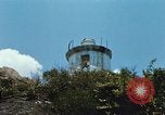 Immagine di Faro francese tower e navi in Cam Ranh Bay Vietnam Cam Ranh Bay Vietnam, 1967, secondo 21 filmato di repertorio 65675023521