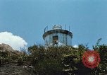 Immagine di Faro francese tower e navi in Cam Ranh Bay Vietnam Cam Ranh Bay Vietnam, 1967, secondo 23 filmato di repertorio 65675023521