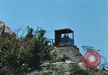Immagine di Faro francese tower e navi in Cam Ranh Bay Vietnam Cam Ranh Bay Vietnam, 1967, secondo 44 filmato di repertorio 65675023521