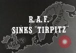 Immagine di Corazzata tedesca Tirpitz bombardato da RAF Tromso Norvegia, 1944, secondo 41 filmato di repertorio 65675023523