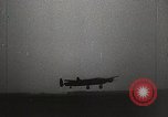 Immagine di Corazzata tedesca Tirpitz bombardato da RAF Tromso Norvegia, 1944, secondo 53 filmato di repertorio 65675023523