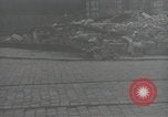 Image of American soldiers fire rifles at snipers in a building Leipzig Germany, 1945, second 9 stock footage video 65675023570
