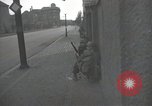 Image of American soldiers fire rifles at snipers in a building Leipzig Germany, 1945, second 12 stock footage video 65675023570