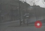 Image of American soldiers fire rifles at snipers in a building Leipzig Germany, 1945, second 14 stock footage video 65675023570