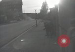 Image of American soldiers fire rifles at snipers in a building Leipzig Germany, 1945, second 22 stock footage video 65675023570