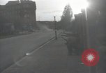 Image of American soldiers fire rifles at snipers in a building Leipzig Germany, 1945, second 23 stock footage video 65675023570