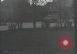 Image of American soldiers fire rifles at snipers in a building Leipzig Germany, 1945, second 30 stock footage video 65675023570
