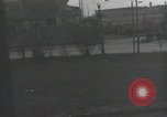 Image of American soldiers fire rifles at snipers in a building Leipzig Germany, 1945, second 32 stock footage video 65675023570
