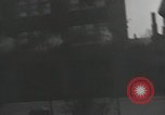 Image of American soldiers fire rifles at snipers in a building Leipzig Germany, 1945, second 35 stock footage video 65675023570