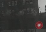 Image of American soldiers fire rifles at snipers in a building Leipzig Germany, 1945, second 37 stock footage video 65675023570