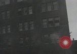 Image of American soldiers fire rifles at snipers in a building Leipzig Germany, 1945, second 40 stock footage video 65675023570