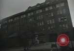 Image of American soldiers fire rifles at snipers in a building Leipzig Germany, 1945, second 49 stock footage video 65675023570
