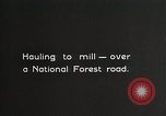 Image of workers load timber United States USA, 1926, second 36 stock footage video 65675023598