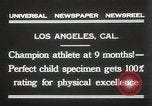 Image of man performs stunts on 9 months baby Los Angeles California USA, 1931, second 3 stock footage video 65675023610