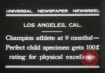 Image of man performs stunts on 9 months baby Los Angeles California USA, 1931, second 4 stock footage video 65675023610
