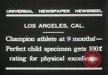 Image of man performs stunts on 9 months baby Los Angeles California USA, 1931, second 7 stock footage video 65675023610