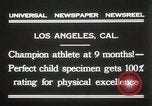 Image of man performs stunts on 9 months baby Los Angeles California USA, 1931, second 8 stock footage video 65675023610