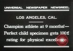 Image of man performs stunts on 9 months baby Los Angeles California USA, 1931, second 10 stock footage video 65675023610