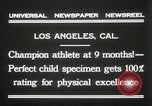 Image of man performs stunts on 9 months baby Los Angeles California USA, 1931, second 12 stock footage video 65675023610