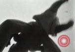 Image of man performs stunts on 9 months baby Los Angeles California USA, 1931, second 13 stock footage video 65675023610