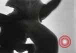 Image of man performs stunts on 9 months baby Los Angeles California USA, 1931, second 17 stock footage video 65675023610