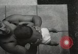 Image of man performs stunts on 9 months baby Los Angeles California USA, 1931, second 21 stock footage video 65675023610