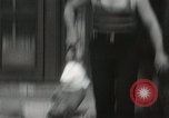 Image of man performs stunts on 9 months baby Los Angeles California USA, 1931, second 39 stock footage video 65675023610