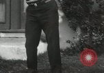 Image of man performs stunts on 9 months baby Los Angeles California USA, 1931, second 60 stock footage video 65675023610