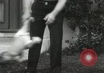 Image of man performs stunts on 9 months baby Los Angeles California USA, 1931, second 61 stock footage video 65675023610