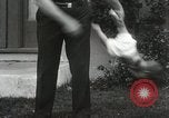 Image of man performs stunts on 9 months baby Los Angeles California USA, 1931, second 62 stock footage video 65675023610